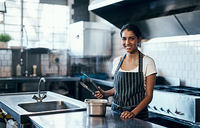 Buy stock photo Cooking, making food and working as a chef in a commercial kitchen with tongs and industrial equipment. Portrait of a female cook preparing a meal for lunch, dinner or supper in a restaurant or cafe