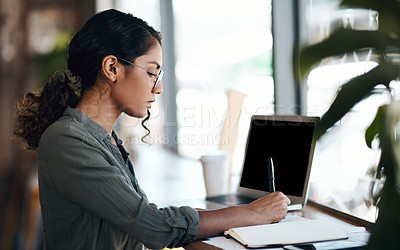 Buy stock photo Writing, serious and freelance young woman working with laptop and notebook at a cafe. Creative remote worker or female student planning, brainstorming a mind map about future career.