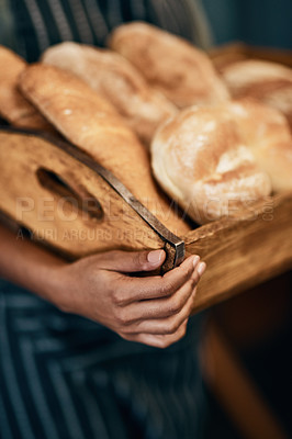 Buy stock photo Bakery, basket and hands of baker with bread in cafe for serving food, products and pastry for small business. Restaurant, shop and server for service, help and baked goods for hospitality in store