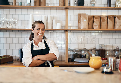 Buy stock photo Business owner, barista standing with arms crossed, looking confident and proud while working at a restaurant. Cafe worker, employee and entrepreneur smiling, giving service and leading a coffee shop