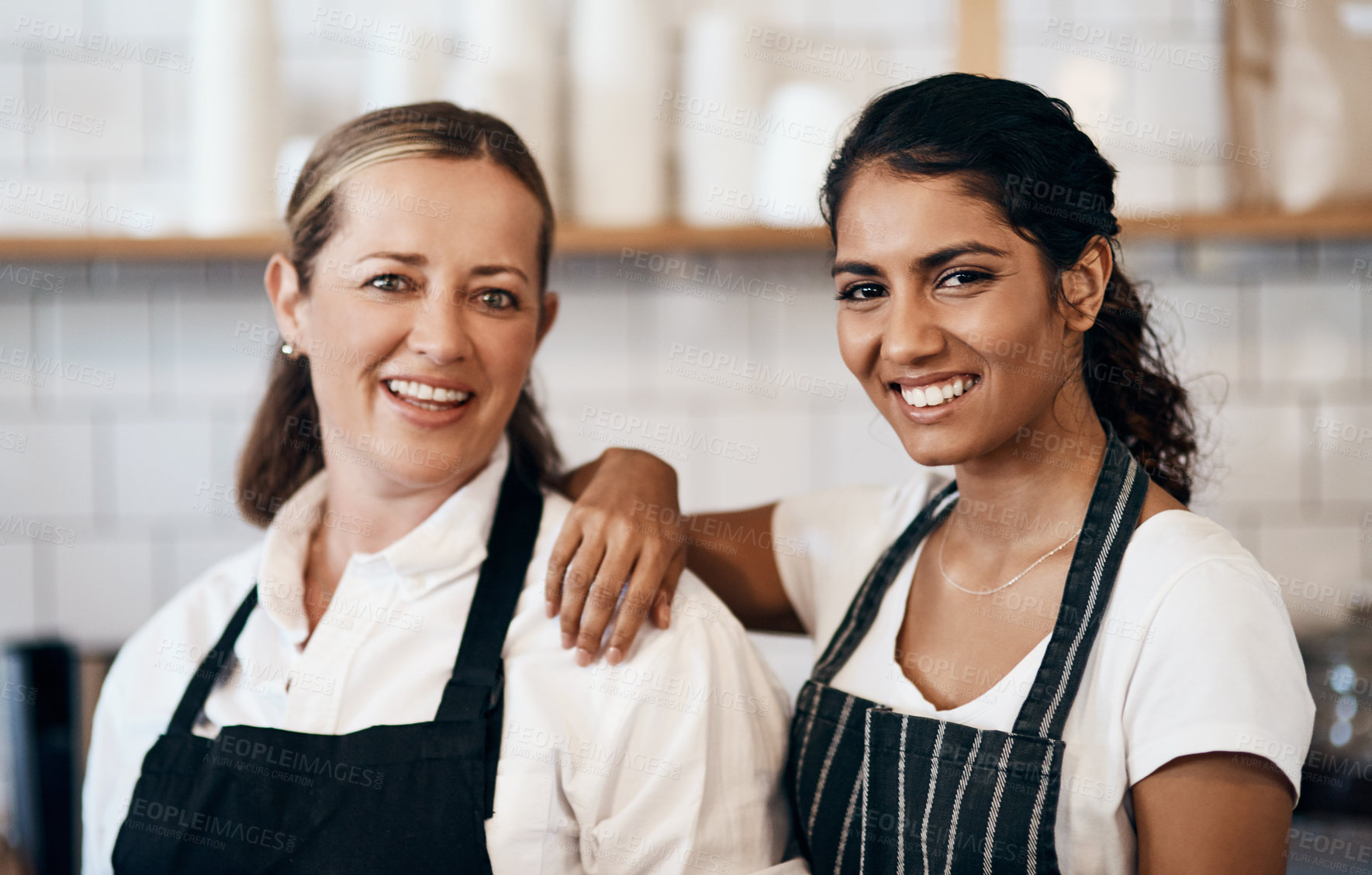 Buy stock photo Portrait of two confident women working together at a cafe