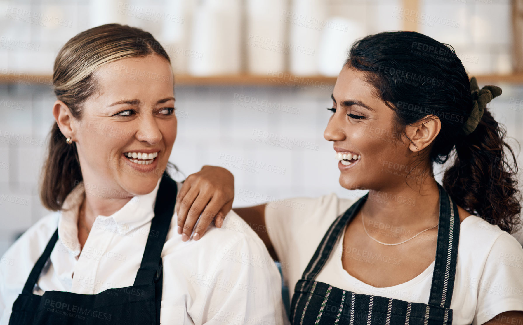 Buy stock photo Shot of two confident women working together at a cafe