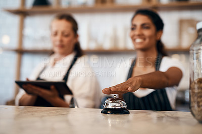 Buy stock photo Waitress hands ringing service bell for a ready order in cafe, restaurant and coffee shop. Waitresses, servers and baristas serving, assisting or alerting waiter staff of prepared orders for people