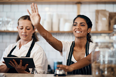 Buy stock photo Shot of a young woman ringing the service bell while working at a cafe