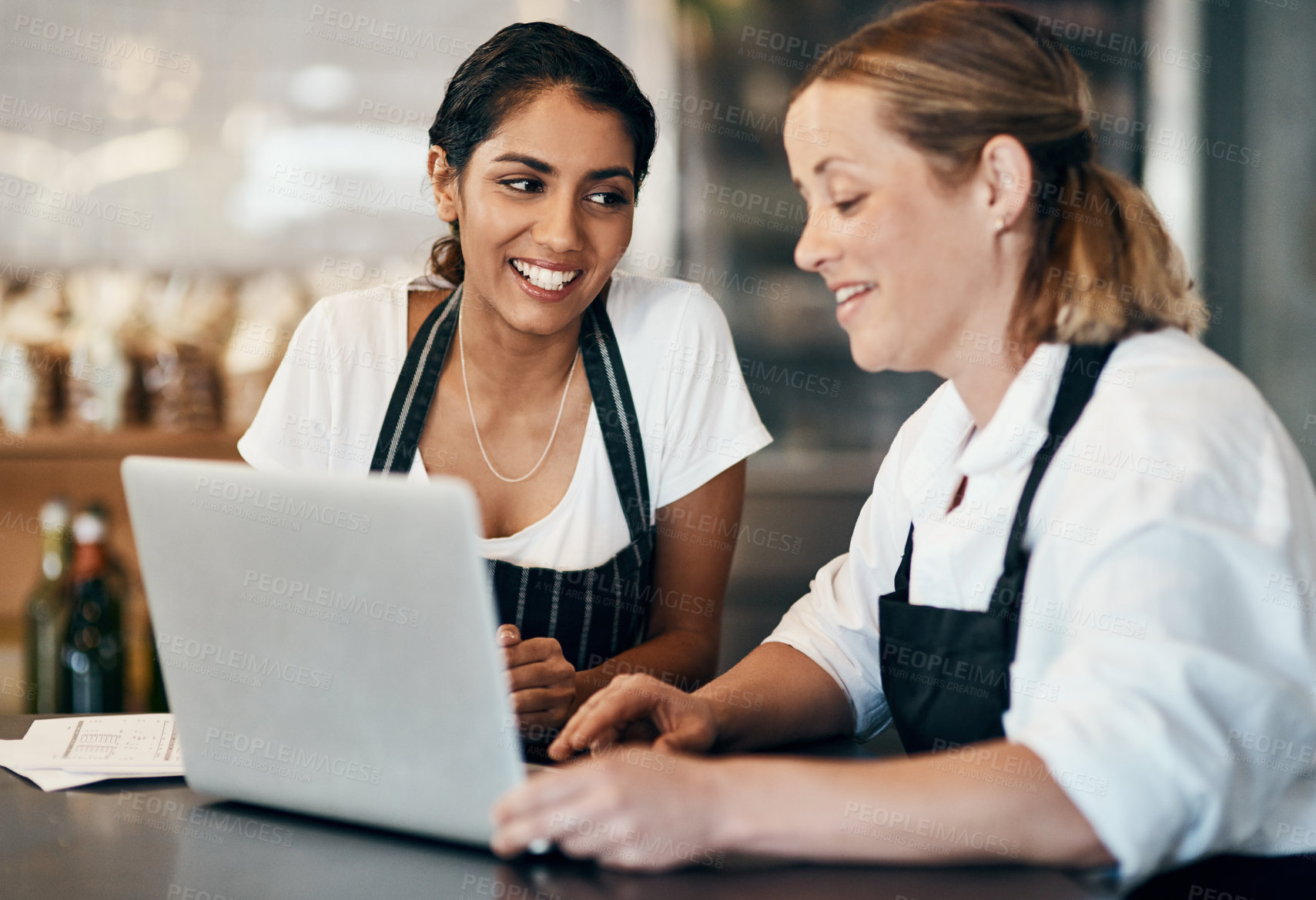 Buy stock photo People, laptop and smile in cafe for startup, networking and brainstorming social media post. Women, small business team and computer at coffee shop table for stock orders, budget review and accounts