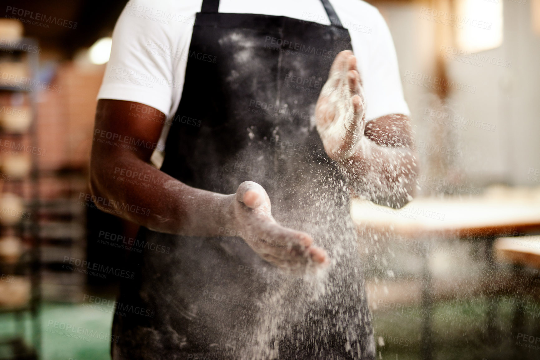 Buy stock photo Black man, hands and dust with flour at bakery for bread, rolls or pastry production at factory. Closeup, male person or baker clapping powder or wheat for handmade ingredients or small business