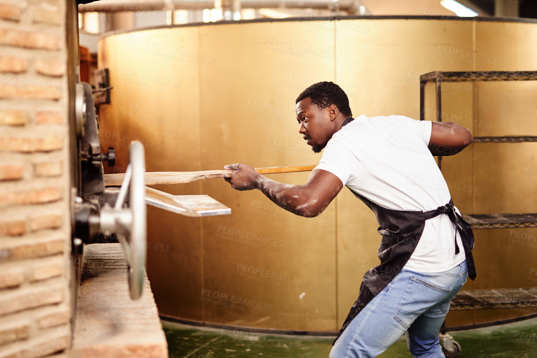 Buy stock photo Baker, bread and black man with oven, skills and confidence with small business, dough and healthy. African person, hobby and employee with nutrition, chef and talent with food, wheat and kitchen