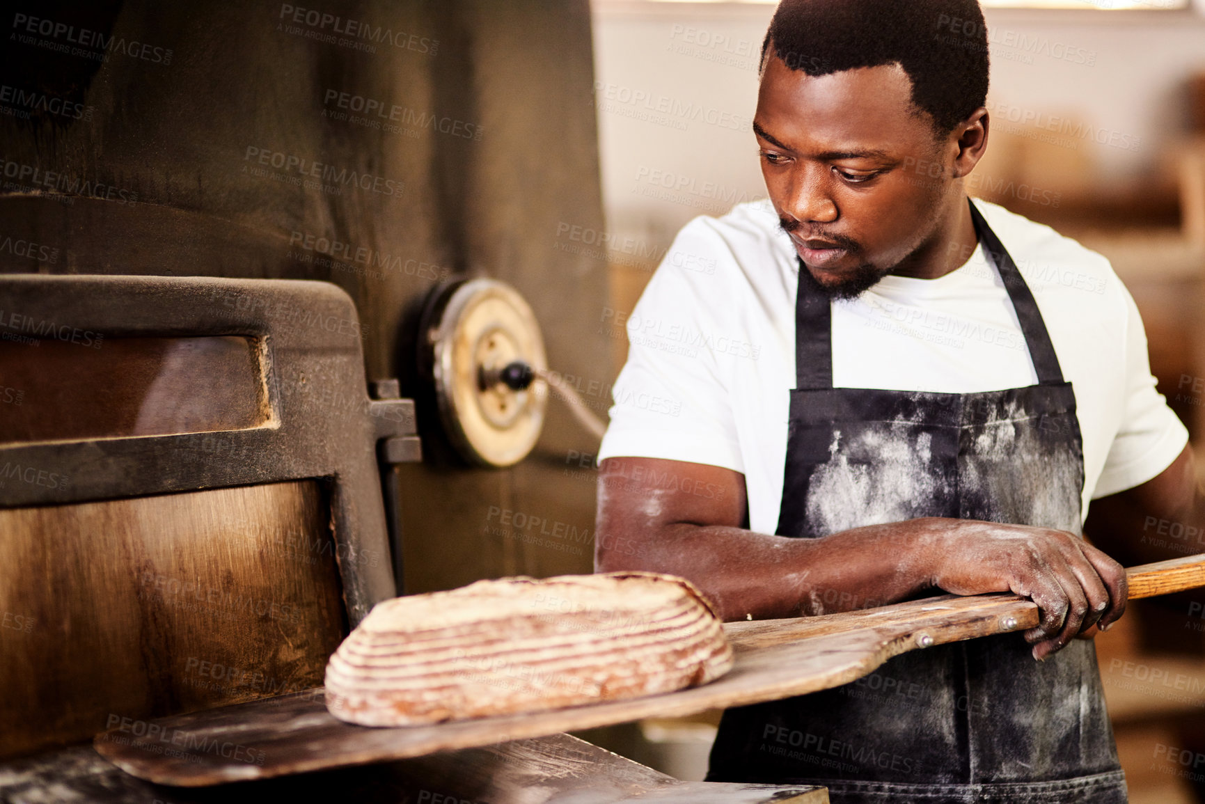 Buy stock photo Black man, rustic bread and oven for chef, small business owner and pastry kitchen workshop. African baker, confidence and catering for coffee shop, retail and cafe startup for restaurant industry