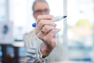 Buy stock photo Closeup shot of a businesswoman writing notes on a glass wall in an office