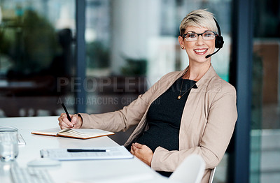 Buy stock photo Portrait of a pregnant businesswoman wearing a headset while working in an office