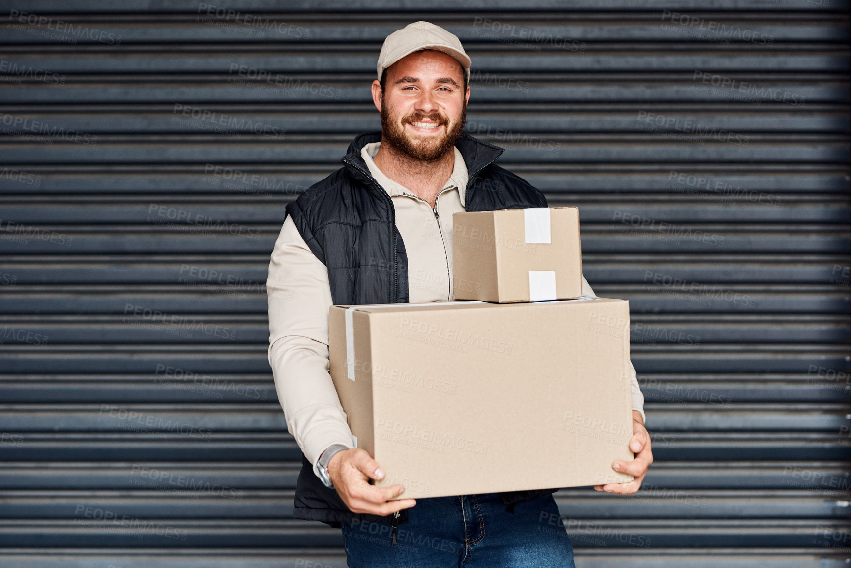 Buy stock photo Portrait of a courier carrying boxes for delivery