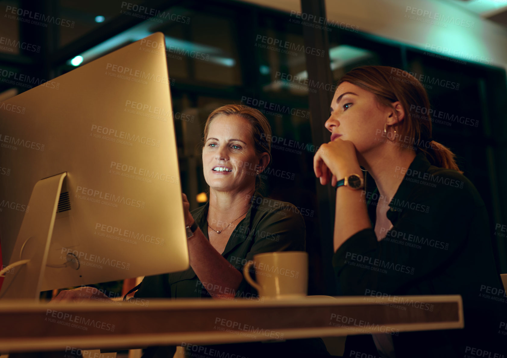 Buy stock photo Night, computer and employee with mentor at desk for collaboration, feedback or project review. Advice, help and business women in discussion for learning, planning report or support in office