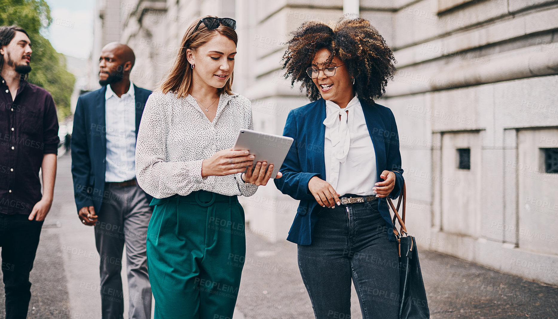 Buy stock photo Business, women and tablet in city with discussion on commute, travel and walking in conversation. Professional, corporate team and employees on sidewalk talking for planning, briefing and networking