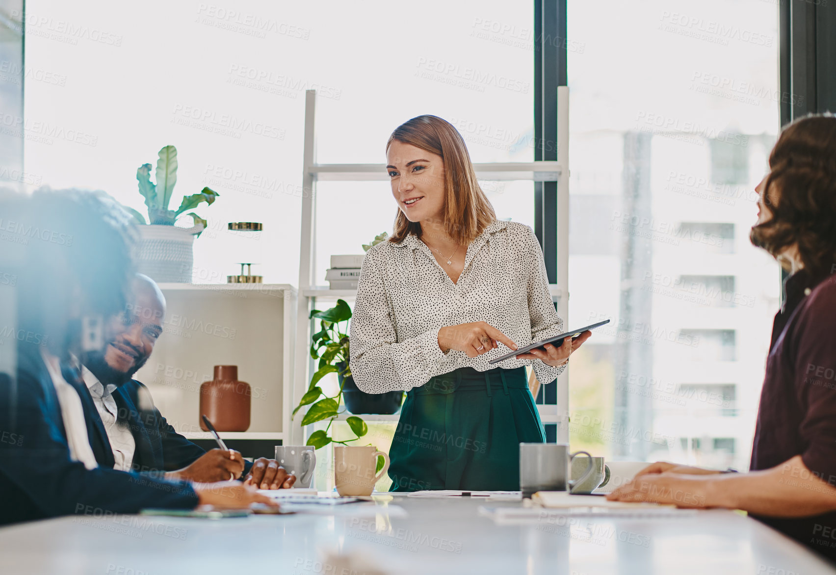 Buy stock photo Businesswoman, tablet and presentation discussion in office with team for budget report or company profit. Finance collaboration, employees or technology with feedback in boardroom for sales planning