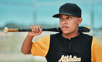 Buy stock photo Shot of a young baseball player holding a baseball bat while posing outside on the pitch