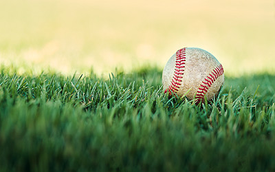 Buy stock photo Shot of a baseball lying on a field