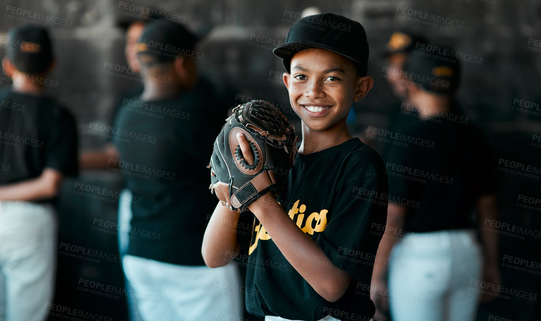 Buy stock photo Portrait of a young baseball player wearing baseball mitts with his teammates standing in the background