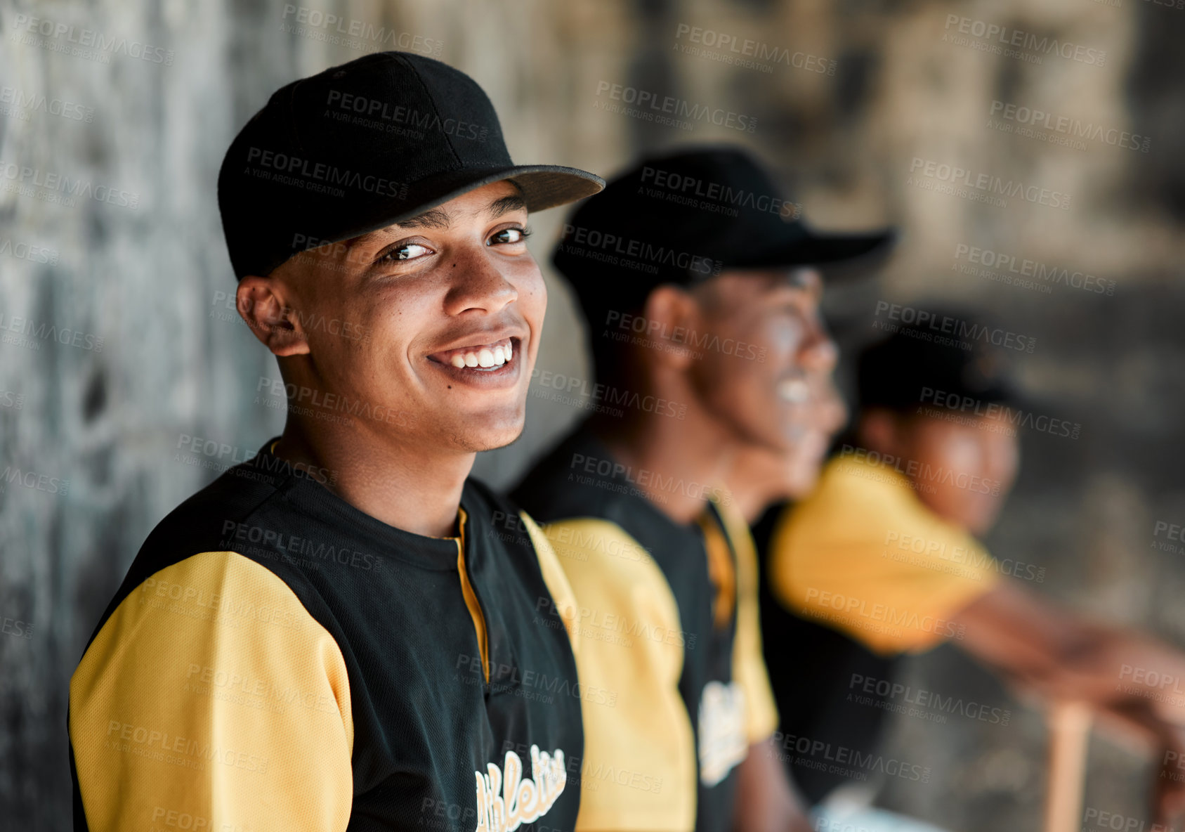 Buy stock photo Portrait of a young baseball player sitting with his teammates