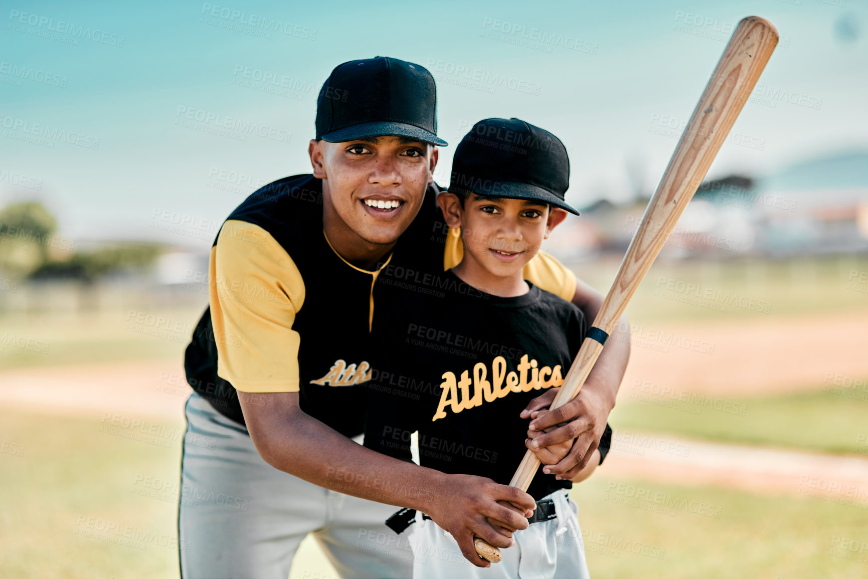 Buy stock photo Shot of two baseball players standing together on the pitch