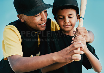 Buy stock photo Shot of a young baseball player showing a little boy how to play