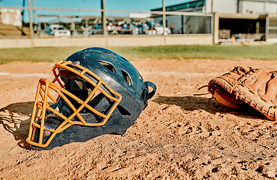 Buy stock photo Shot of a catcher's helmet lying on a baseball field