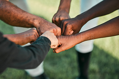 Buy stock photo Cropped shot of a group of unrecognizable baseball players putting their hands together
