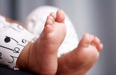 Buy stock photo Cropped shot of an unrecognisable baby’s adorable feet at home