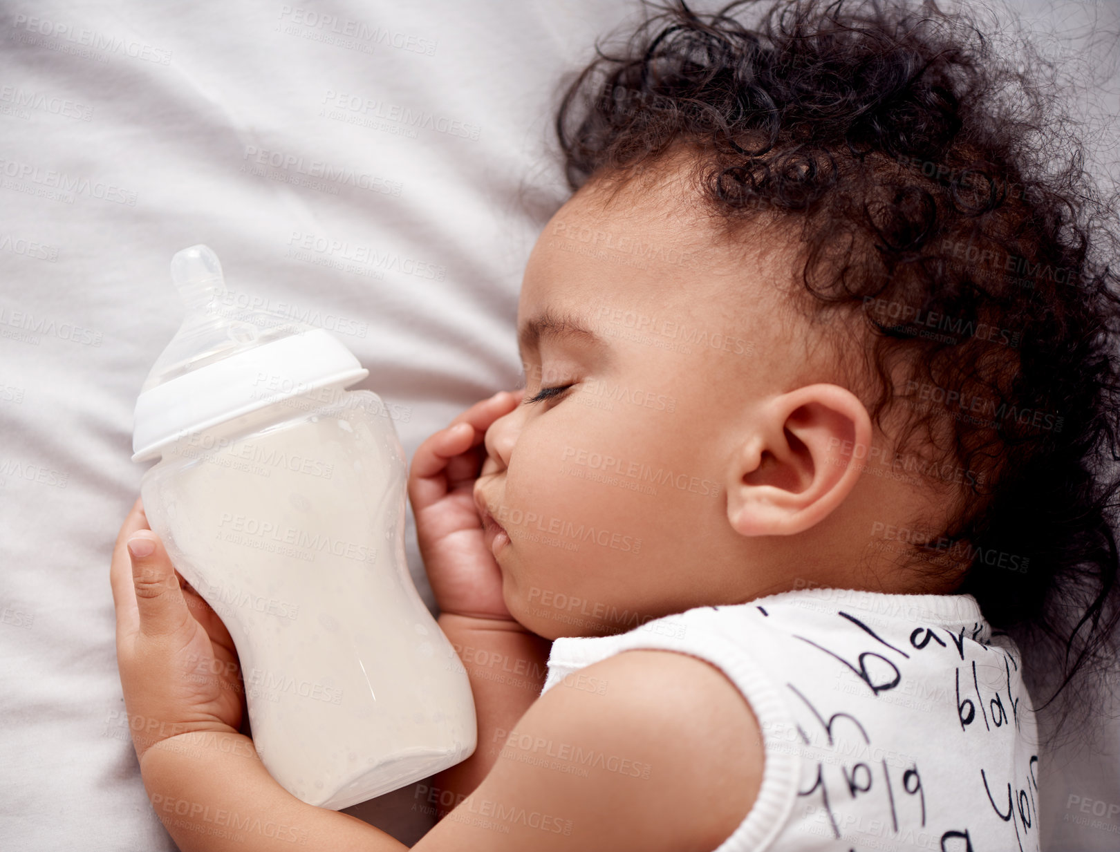 Buy stock photo Baby, milk bottle and sleeping in the morning on nursery bed and blanket with nap and rest. Relax, calm and tired newborn with youth on bedding for kid asleep from above in a family home and bedroom