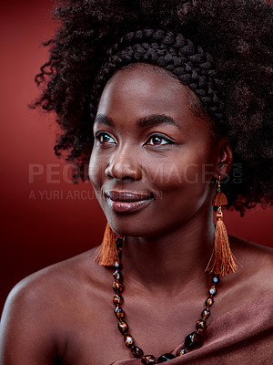 Buy stock photo Cropped shot of a beautiful young woman posing against a red background
