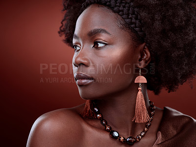 Buy stock photo Natural, beauty and black woman in studio with glowing skin on gradient, maroon or red background. Face, body care and African lady model with culture, pride and cosmetic or isolated art aesthetic 