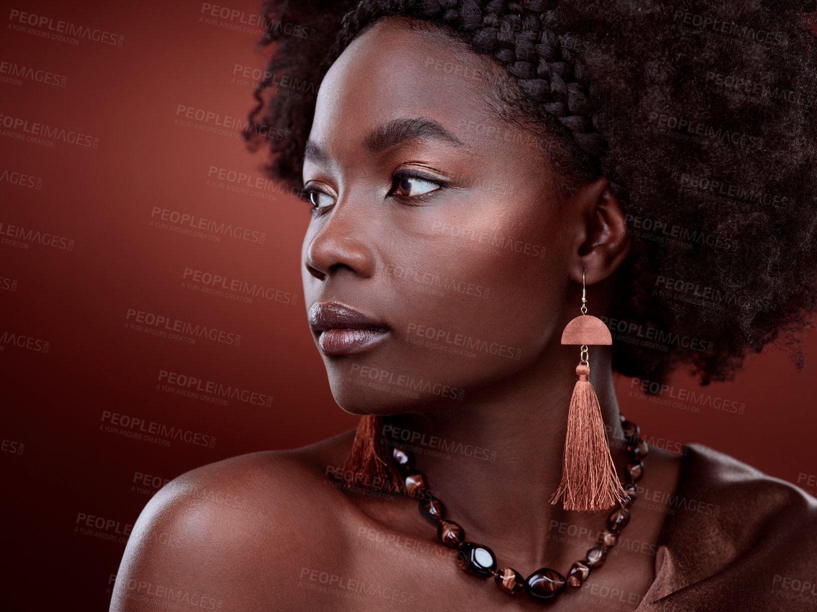 Buy stock photo Natural, beauty and black woman in studio with glowing skin on gradient, maroon or red background. Face, body care and African lady model with culture, pride and cosmetic or isolated art aesthetic 