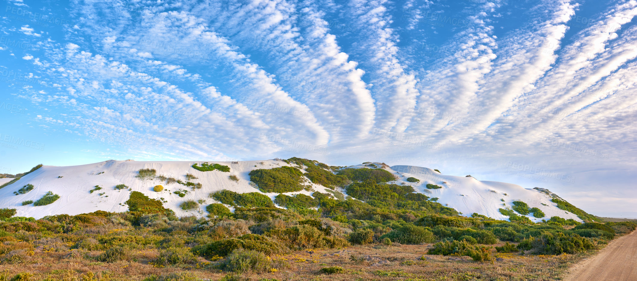 Buy stock photo Sand dune at sunset with clouds