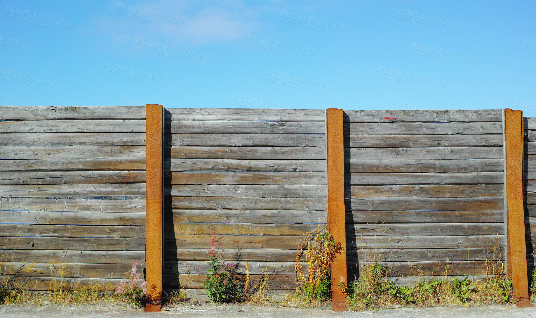 Buy stock photo Old wooden fence outside in a garden at home. The vintage architecture of an enclosure surrounding a house used for privacy, designing, and landscaping to decorate or protect a house with copy space