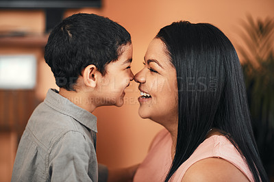 Buy stock photo Shot of a mother and her little son bonding together at home