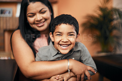 Buy stock photo Portrait of an adorable little boy bonding with his mother at home