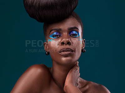 Buy stock photo Portrait, makeup and glamour with an african woman in studio on a blue background for hair care or cosmetics. Face, confidence and fashion with an attractive young female model at the salon for style