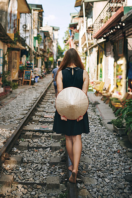 Buy stock photo Travel, straw hat and back of woman by railway on vacation, weekend trip or getaway in Thailand. Outdoor, sightseeing and person with traditional Ngob for tourism, journey or holiday with adventure.