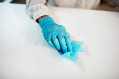 Buy stock photo Closeup shot of an unrecognisable businesswoman cleaning her workspace in an office