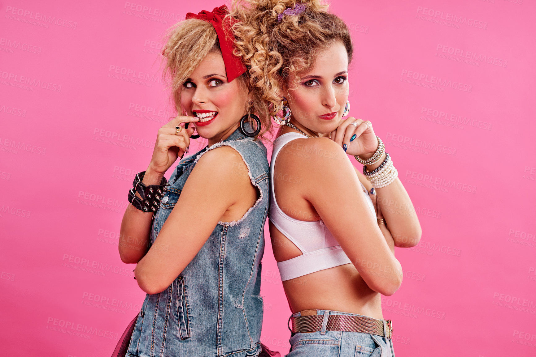 Buy stock photo Studio shot of two beautiful young women styled in 80s clothing