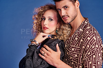 Buy stock photo Studio shot of a young couple styled in 80s clothing