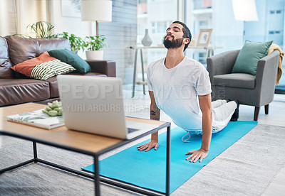 Buy stock photo Cobra stretch, man and meditation for yoga, mindfulness exercise and zen in online class on laptop at home. Flexible, yogi and person with peace, calm and holistic wellness for body health or fitness