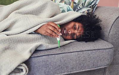 Buy stock photo Sick, woman and check temperature on sofa for allergy, flu or covid to rest in home. African girl, blanket and thermometer for health, virus infection or reading medical test for bacteria with stress