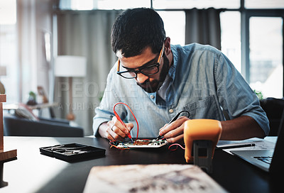 Buy stock photo Cropped shot of a young engineer working from home