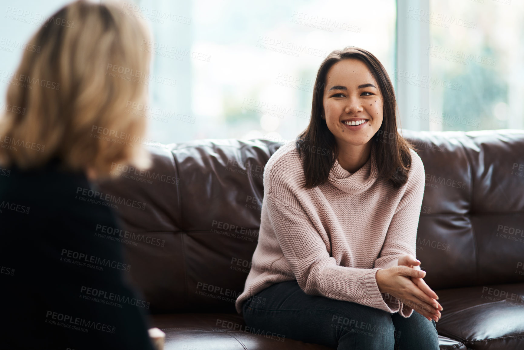 Buy stock photo Therapy, happy women have a conversation on sofa and speaking or talking with a psychologist. Mental health or communication, support or consulting and people on couch have a discussion together