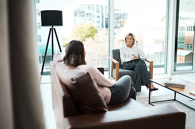 Buy stock photo Shot of a mature psychologist having a therapeutic session with her patient