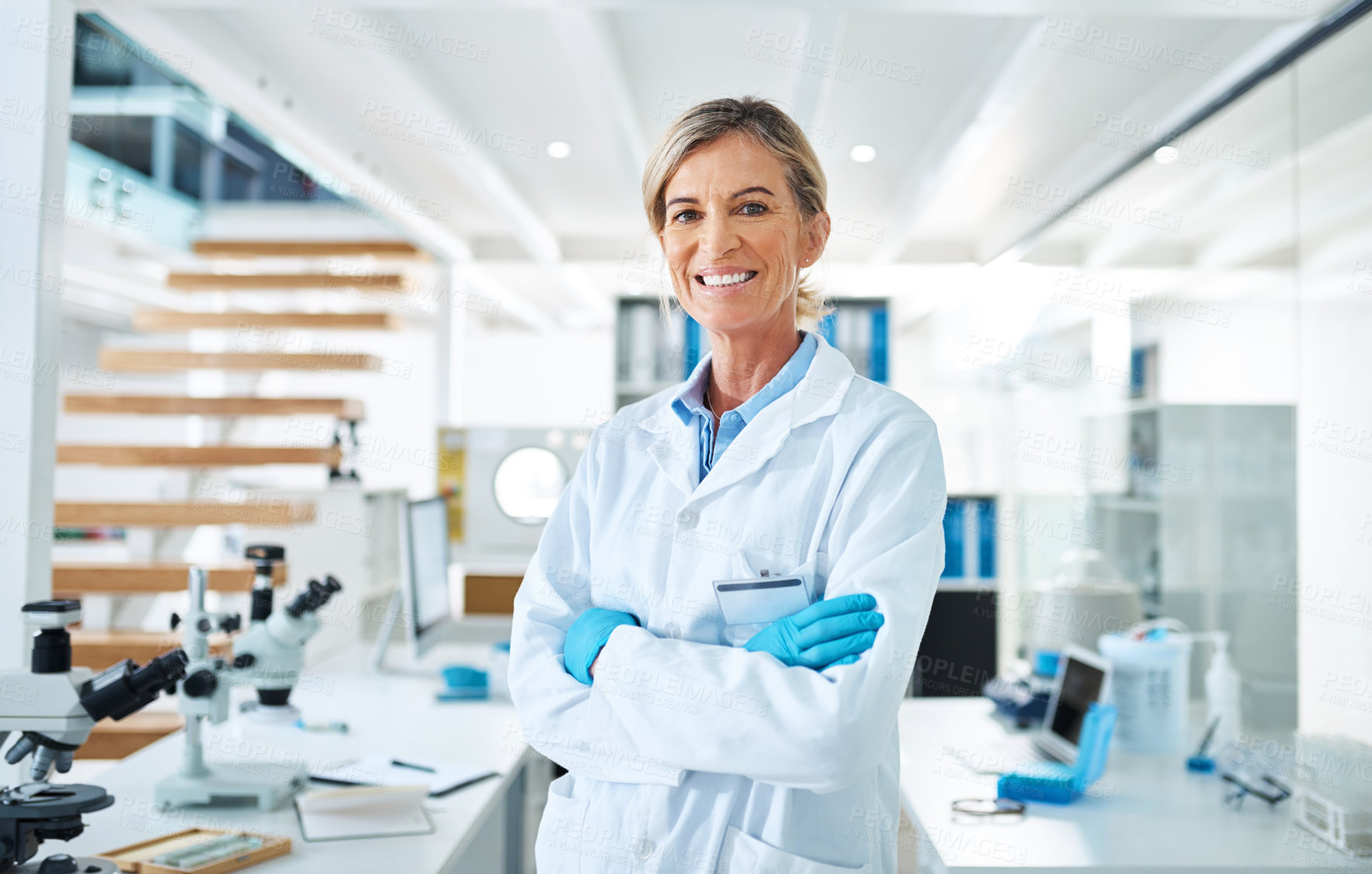 Buy stock photo Mature woman, scientist and ppe in portrait for medical research, innovation and phd in science lab. Female person, happiness and confidence in pharmaceutical, chemistry and biotech with arms crossed