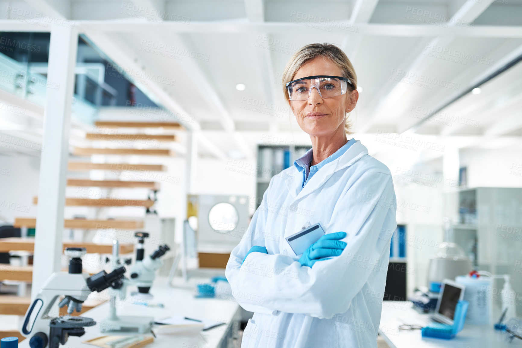 Buy stock photo Female person, scientist and ppe in portrait for medical research, innovation and phd in science lab. Mature woman, serious and confidence in pharmaceutical, chemistry and biotech with arms crossed