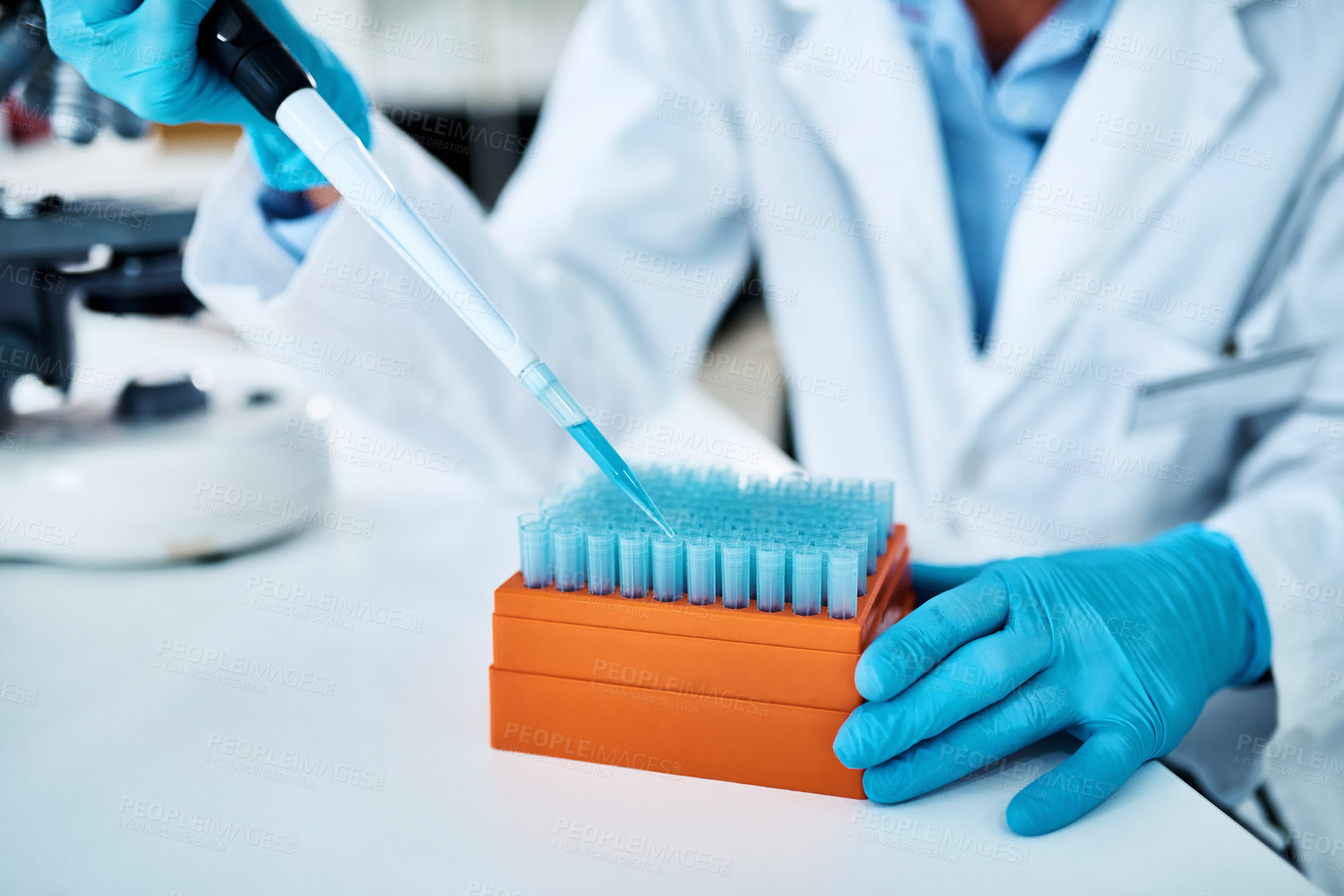 Buy stock photo Closeup shot of an unrecognisable scientist using a dropper while working with samples in a lab