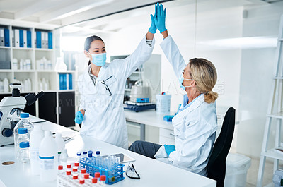 Buy stock photo Women, scientist and high five in lab with success, face mask and goals with results at pharma company. People, mentor and feedback with cheers, celebration and medical research for mpox vaccine