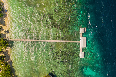 Buy stock photo Nature, tropical and drone of sea, water and resort in Maldives, travel and vacation for summer. Holiday, tourism and seascape of beach, high angle and vibrant for adventure, outdoor and paradise